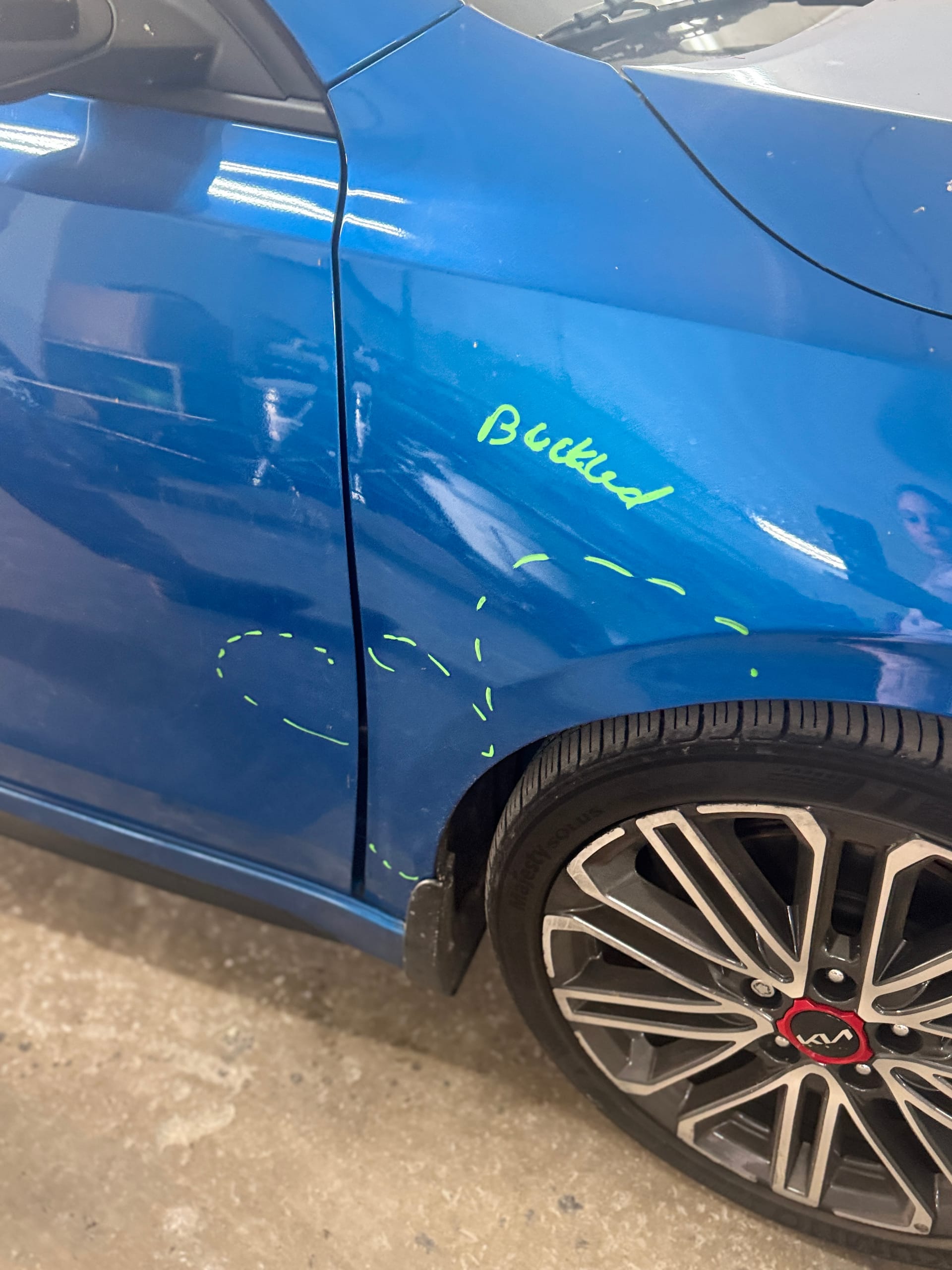 Kia Forte GT fender marked as buckled during the damage estimate