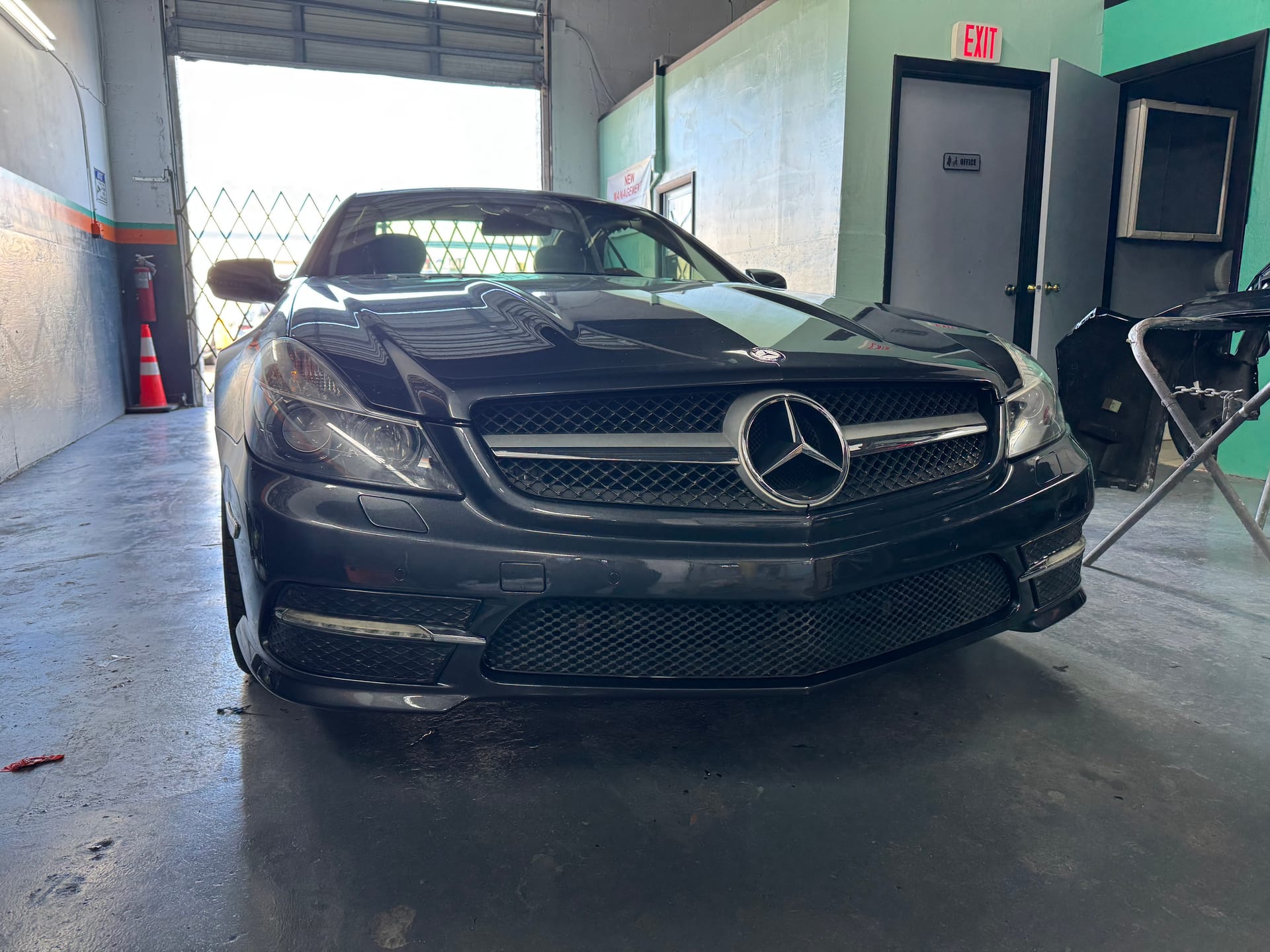 The same Mercedes-Benz with the bumper refinished in gloss black at KAG Auto Collision Center