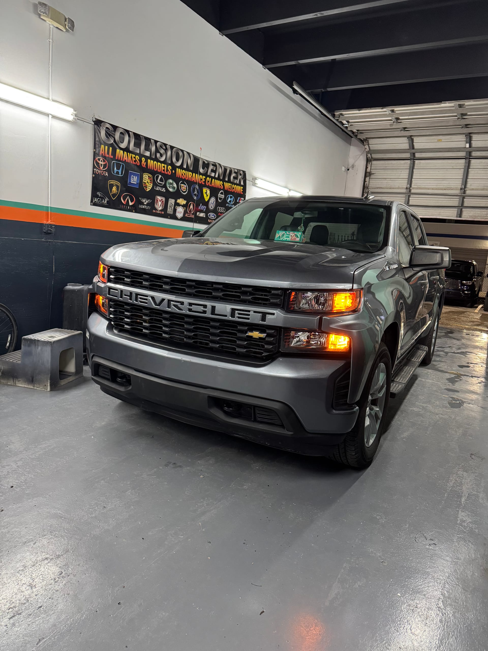 Chevy Silverado with a rebuilt front end on the KAG shop floor